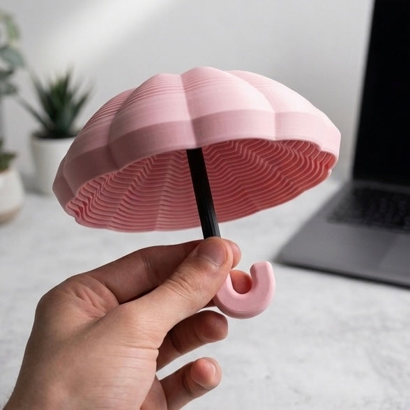 Fidget Umbrella Rosa – in der Hand gehalten
